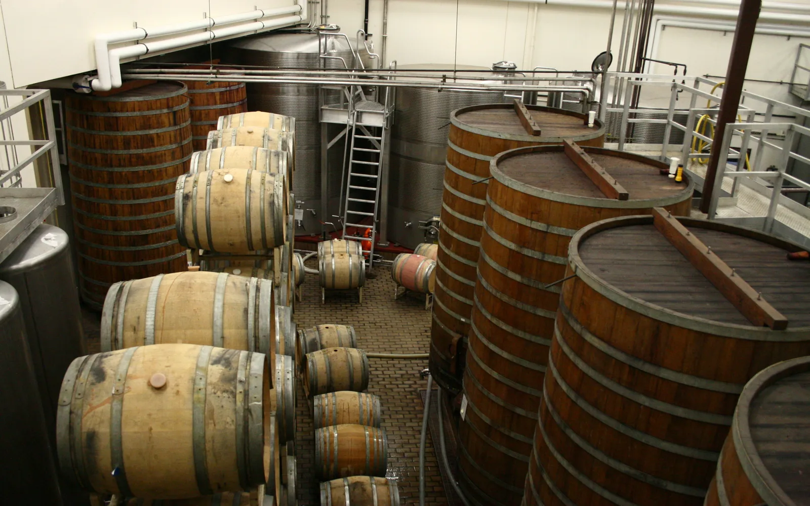 Wine barrels during fermentation at Sterling Winery, showing the oak barrel tanks used in California wine production